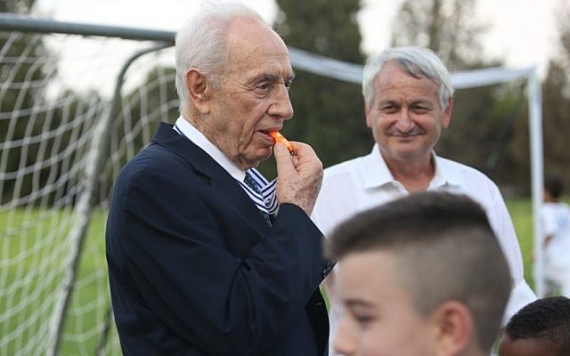 Former President Shimon Peres blows a whistle at the kick-off event for a Jewish-Arab coexistence soccer program in Kibbutz Dorot on Monday. (photo: COURTESY Peres Center for Peace/Efrat Saar) Former President Shimon Peres blows a whistle at the kick-off event for a Jewish-Arab coexistence soccer program in Kibbutz Dorot on Monday. (photo: COURTESY Peres Center for Peace/Efrat Saar)
