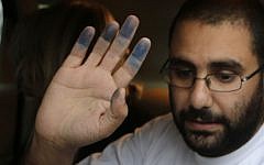 Egyptian activist Alaa Abdel Fattah upon his release from Tora prison in Cairo, September 15, 2014 (photo credit: AP/Amr Nabil)