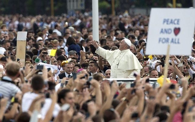 Pope Francis waves to faithful as he is driven through the crowd, in mother Teresa square, in Tirana, Sunday, September 21, 2014. (photo credit: AP Photo/Alessandra Tarantino) Pope Francis waves to faithful as he is driven through the crowd, in mother Teresa square, in Tirana, Sunday, September 21, 2014. (photo credit: AP Photo/Alessandra Tarantino)