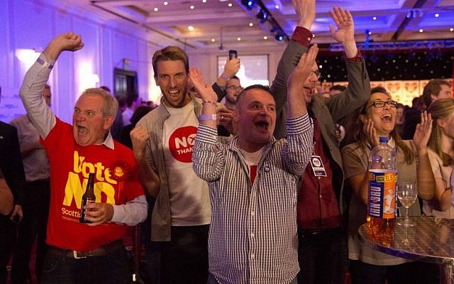 No supporters for the Scottish independence referendum celebrate an early result at a No campaign event at a hotel in Glasgow, Scotland, early Friday, Sept. 19, 2014. (AP Photo/Matt Dunham) No supporters for the Scottish independence referendum celebrate an early result at a No campaign event at a hotel in Glasgow, Scotland, early Friday, Sept. 19, 2014. (AP Photo/Matt Dunham)