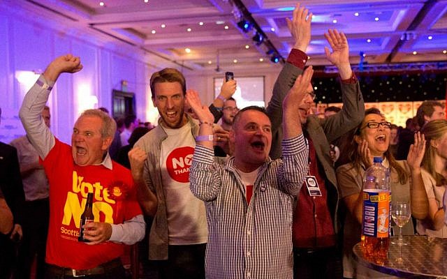 'No' supporters of the Scottish independence referendum celebrate an early result at a 'No' campaign event at a hotel in Glasgow, Scotland, Friday, September 19, 2014. (photo credit: AP/Matt Dunham) 'No' supporters of the Scottish independence referendum celebrate an early result at a 'No' campaign event at a hotel in Glasgow, Scotland, Friday, September 19, 2014. (photo credit: AP/Matt Dunham)