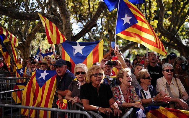 People wave 'estelada' flags, symbolizing Catalonia's independence during a demonstration calling for the independence of Catalonia in Barcelona, Spain, Friday, Sept. 19, 2014. (Photo credit: AP/Manu Fernandez) People wave 'estelada' flags, symbolizing Catalonia's independence during a demonstration calling for the independence of Catalonia in Barcelona, Spain, Friday, Sept. 19, 2014. (Photo credit: AP/Manu Fernandez)