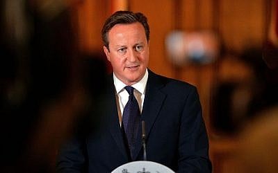 Britain's Prime Minister, David Cameron, makes a statement to the media on the killing of British aid worker David Haines in Downing Street, central London, Sunday Sept. 14, 2014. (Photo credit: AP/PA, John Stillwell) 