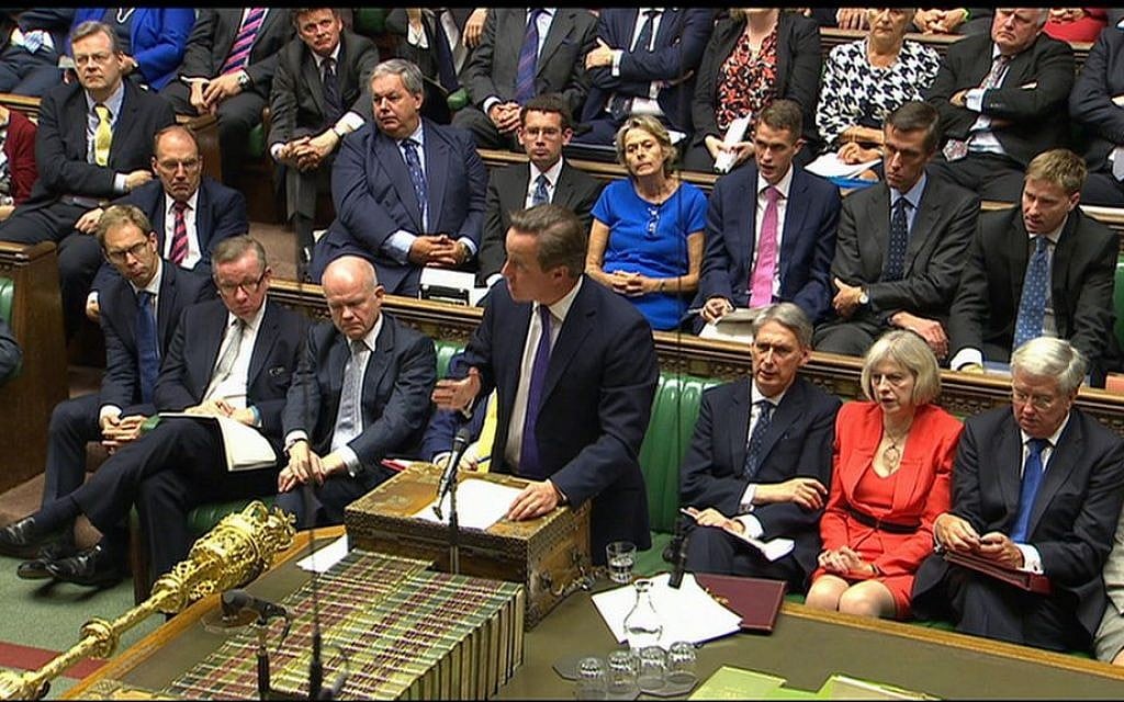 British Prime Minister David Cameron (front, center) speaks during a debate in the Houses of Parliament, Friday, September 26, 2014 (photo credit: AP/Parliamentary Recording Unit) British Prime Minister David Cameron (front, center) speaks during a debate in the Houses of Parliament, Friday, September 26, 2014 (photo credit: AP/Parliamentary Recording Unit)