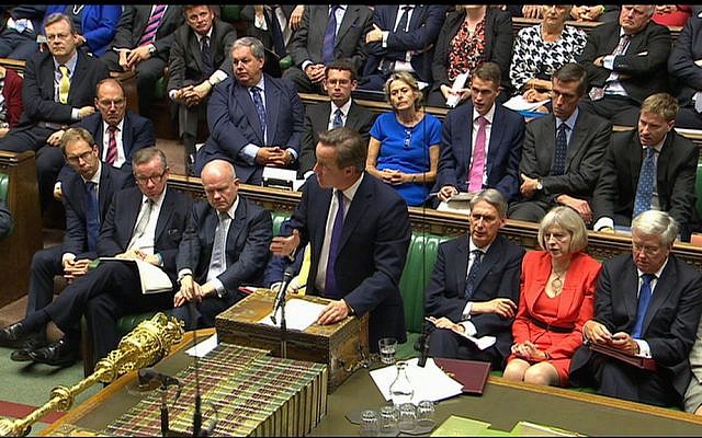 British Prime Minister David Cameron (front, center) speaks during a debate in the Houses of Parliament, Friday, September 26, 2014 (photo credit: AP/Parliamentary Recording Unit)