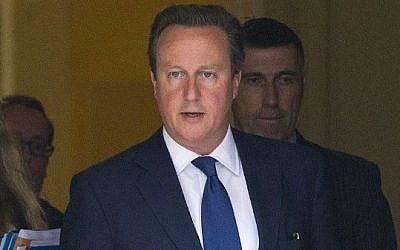 British Prime Minister David Cameron leaves 10 Downing Street in central London on 3, September 2014, after chairing an emergency meeting following the execution of a second US journalist by Islamist fighters in Iraq and the threat that a British hostage will be next. (photo credit: AFP PHOTO / JUSTIN TALLIS)
