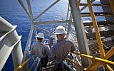 Workers on the Israeli 'Tamar' gas processing rig, 24 km off the Israeli southern coast of Ashkelon. (Moshe Shai/FLASH90)