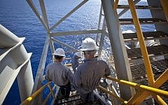 Workers on the Israeli 'Tamar' gas processing rig, 24 km off the Israeli southern coast of Ashkelon. (Moshe Shai/FLASH90)