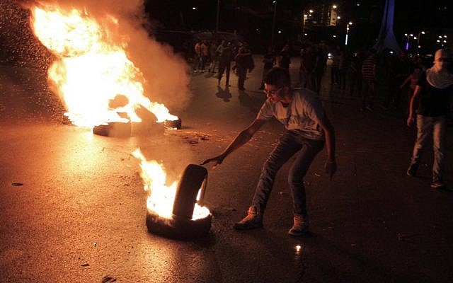 Palestinians clashing with Israeli soldiers in the West Bank on July 9, 2014. (Photo credit: Issam Rimawi/Flash90) Palestinians clashing with Israeli soldiers in the West Bank on July 9, 2014. (Photo credit: Issam Rimawi/Flash90)