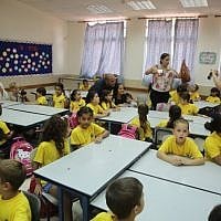 First-grade students are welcomed to the Ben Yehezkel Elementary School in Ashkelon on the first day of the new school year, September 1, 2014. (photo credit: Edi Israel/Flash90) First-grade students are welcomed to the Ben Yehezkel Elementary School in Ashkelon on the first day of the new school year, September 1, 2014. (photo credit: Edi Israel/Flash90)