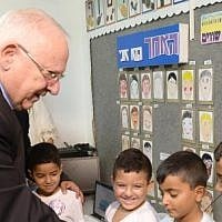 President Reuven Rivlin visits the Agricultural Elementary School, Itzhak Sade, in Dimona, to kick off the new school year on September 1, 2014. (photo credit: Mark Neyman/GPO/Flash90) President Reuven Rivlin visits the Agricultural Elementary School, Itzhak Sade, in Dimona, to kick off the new school year on September 1, 2014. (photo credit: Mark Neyman/GPO/Flash90)