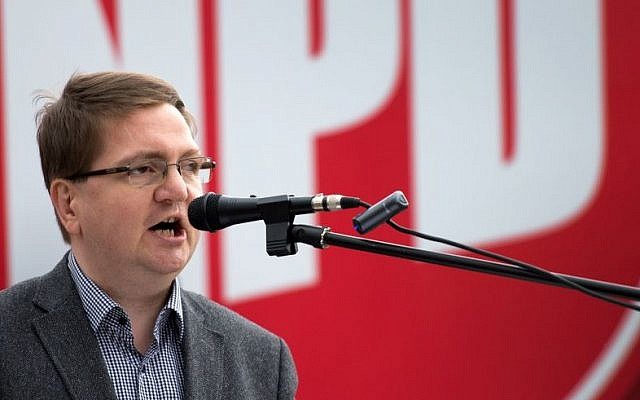 The chairman of the National Democratic Party of Saxony State, Holger Szymanski, speaks during an May 2014 election rally in Dresden, eastern Germany. (photo credit: AP Photo/dpa, Arno Burgi, file) The chairman of the National Democratic Party of Saxony State, Holger Szymanski, speaks during an May 2014 election rally in Dresden, eastern Germany. (photo credit: AP Photo/dpa, Arno Burgi, file)