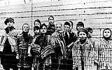 This picture from January, 1945 shows a group of children wearing concentration camp uniforms  (Auschwitz) Nazi concentration camp,  just after their liberation by the Soviet army. (photo credit: AP Photo)