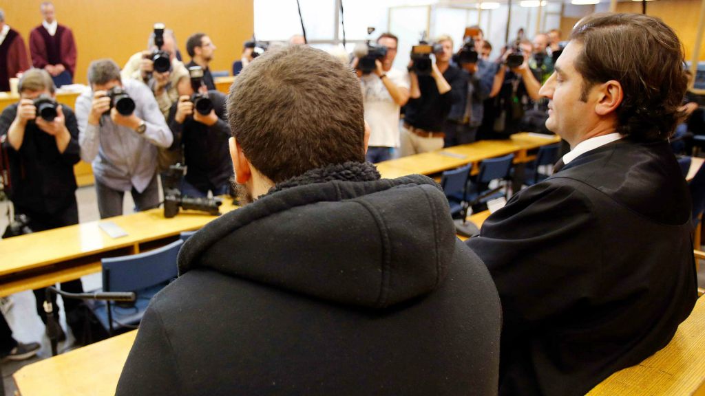 German Kreshnik Berisha, left, waits for the beginning of his trial at a higher regional court in Frankfurt, Germany, Monday, Sept.15, 2014. He is accused of having been a member of the Islamic state group in Syria. (photo credit: AP/Michael Probst) German Kreshnik Berisha, left, waits for the beginning of his trial at a higher regional court in Frankfurt, Germany, Monday, Sept.15, 2014. He is accused of having been a member of the Islamic state group in Syria. (photo credit: AP/Michael Probst)
