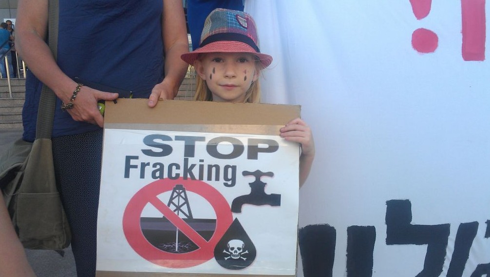 A young girl at a protest on September 10 against exploratory drilling in the Golan. (photo credit: Melanie Lidman/Times of Israel)