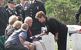 Florence Gantt, a volunteer who consoles mourners at Arlington National Cemetery, speaks to David Rogers, the nephew of Pfc. Bernard Gavrin who died in Saipan in 1944 and who was buried September 12 2014 (Photo credit: Ron Kampeas/JTA)