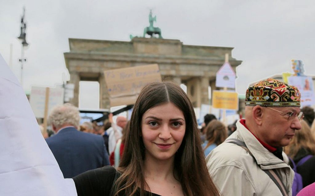 Julia, a Christian Syrian refugee from Damascus, attended the Berlin protest against rising German anti-Semitism. She said many Syrians support Israel but are afraid to say so publicly. (Micki Weinberg/The Times of Israel) Julia, a Christian Syrian refugee from Damascus, attended the Berlin protest against rising German anti-Semitism. She said many Syrians support Israel but are afraid to say so publicly. (Micki Weinberg/The Times of Israel)