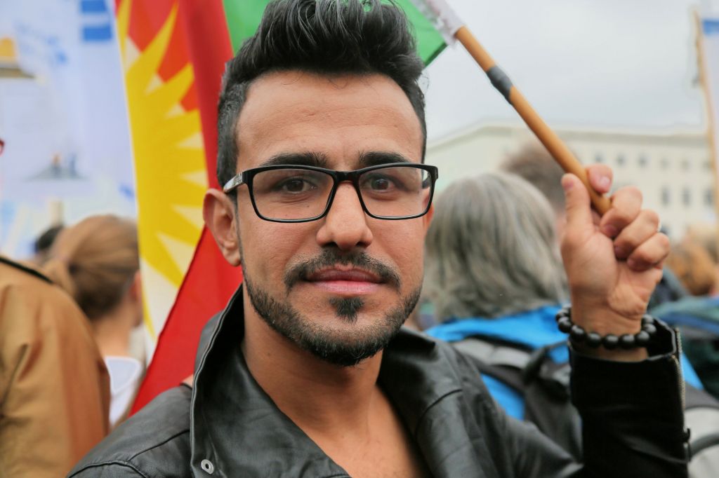 Mulsim Benno Bahman from Erbil in Iraqi Kurdistan carried a large Kurdish flag at the September 14, 2014 rally against anti-Semitism in Berlin. (Micki Weinberg/The Times of Israel) Mulsim Benno Bahman from Erbil in Iraqi Kurdistan carried a large Kurdish flag at the September 14, 2014 rally against anti-Semitism in Berlin. (Micki Weinberg/The Times of Israel)