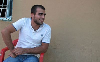 Turkish truck driver Ozgur Simsek, who was held captive by Islamic State, listens during an interview at his home in Silopi, Turkey, Friday, Sept. 26, 2014, (photo credit:AP/Raphael Satter)