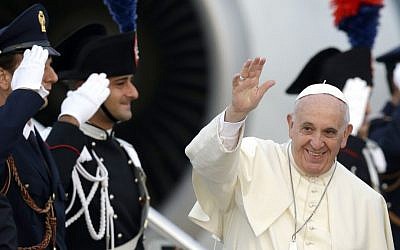 Pope Francis waves as he boards a plane on his way to Albania, at Rome's Fiumicino international airport, on Sunday, September 21, 2014. (photo credit: AP Photo/Andrew Medichini)