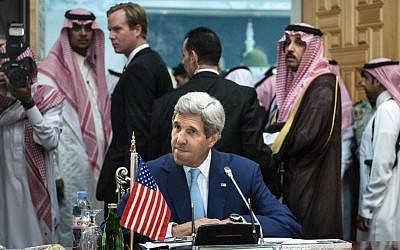 US Secretary of State John Kerry waits for the start of a meeting of the Gulf Arab region at King Abdulaziz International Airport in Jiddah, Saudi Arabia, on September 11, 2014. (photo credit: AP Photo/Brendan Smialowski)