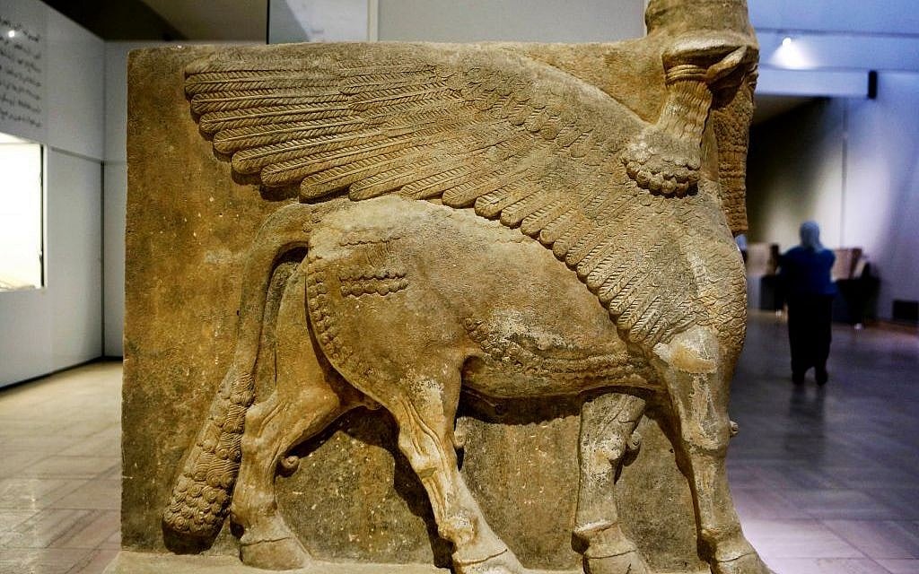 This Monday, Sept. 15, 2014 photo shows a winged bull made out of limestone displayed at the Iraqi National Museum in Baghdad. (AP Photo/Hadi Mizban)