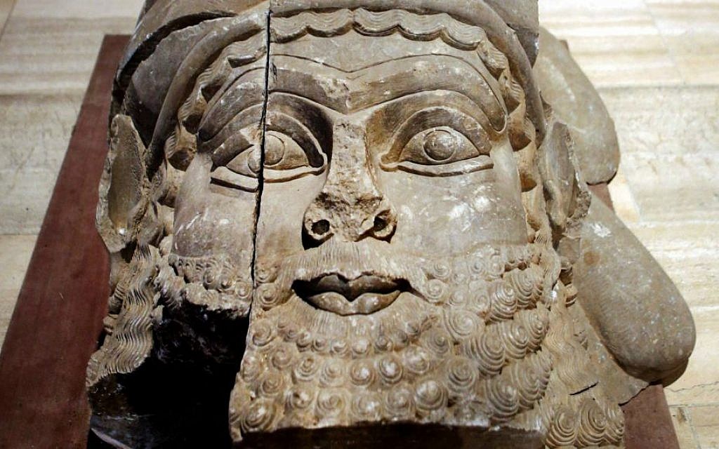 This Monday, Sept. 15, 2014 photo shows the head of a winged bull made out of limestone restored and displayed at the Iraqi National Museum in Baghdad. (AP Photo/Hadi Mizban)