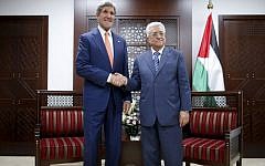 In this July 23, 2014, file photo, US Secretary of State John Kerry meets with Palestinian Authority President Mahmoud Abbas, right, in Ramallah. (Photo credit: AP/Charles Dharapak)
