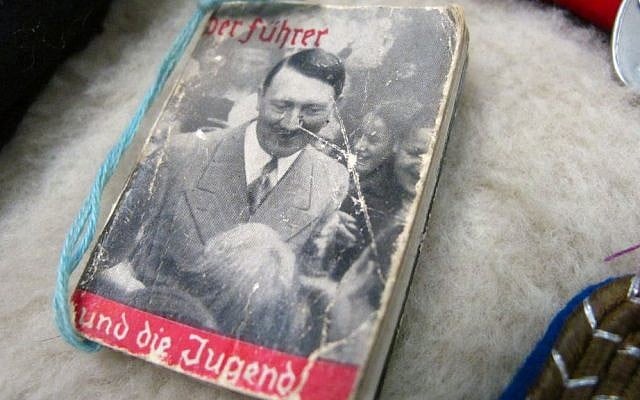 This photo dated Friday, Sept. 19, 2014, shows a tiny Hitler propaganda booklet at an auction house in Anchorage, Alaska. (AP Photo/Rachel D'Oro)