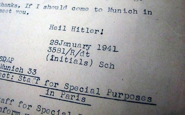 This photo dated Friday, Sept. 19, 2014, in Anchorage, Alaska, shows a Nuremberg trial document that belonged to Maxine Carr, a stenographer who was assigned to cover the war-crimes trials after World War II. Carbon copies of trial transcripts and other Nuremberg mementos from the late Anchorage resident are being auctioned off Saturday through the Alaska Auction Co. (AP Photo/Rachel D'Oro)