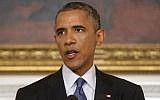 In this Aug. 7, 2014 file photo, President Barack Obama speaks in the State Dining Room of the White House in Washington. (Photo credit: AP/Charles Dharapak, File)