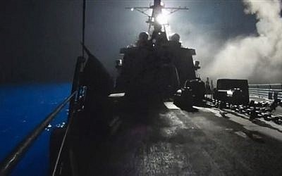 In this image made from video released by the U.S. Navy on Tuesday, Sept. 23, 2014, missiles bound for Syrian Islamic State group targets are launched off of a U.S. Navy ship.  (AP Photo/U.S. Navy via AP video)