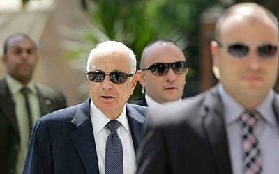 Egyptian bodyguards flank Arab League Secretary-General Nabil Elaraby, second left, upon his arrival at the league's headquarters in Cairo, Egypt, Egypt, Monday, Sept. 8, 2014 (photo credit: AP/Amr Nabil)