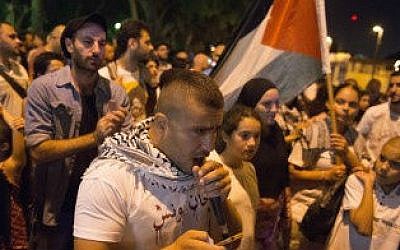 arabi2 A speaker at an Arab-Israeli protest in Jaffa against Israel’s military operation in the Gaza Strip, July 24, 2014 (photo credit: Danielle Shitrit/Flash90)