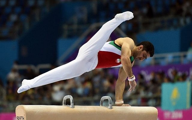 Saeed Raza Keikha of Iran competes in the artistic gymnastics men's pommel horse individual qualifications and team final at Namdong Gymnasium during the 2014 Asian Games in Incheon on September 21, 2014. (photo credit: AFP PHOTO / Prakash SINGH) Saeed Raza Keikha of Iran competes in the artistic gymnastics men's pommel horse individual qualifications and team final at Namdong Gymnasium during the 2014 Asian Games in Incheon on September 21, 2014. (photo credit: AFP PHOTO / Prakash SINGH)