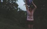 Illustrative: Ohio University Student Senate President Megan Marzec performs an anti-Israel 'Blood Bucket Challenge.' (screen capture, YouTube)