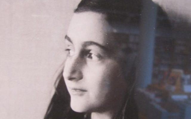 Photograph taken in the Anne Frank House book shop with her image and translated copies of the diary in the background. (Matt Lebovic/The Times of Israel)