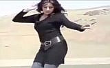 An Iranian woman dances on top of a car without the mandatory hijab (photo credit: Youtube)