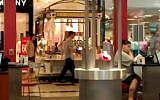 Illustrative photo of a kiosk selling Israeli beauty products at an American mall. The individuals in the photograph are not related to the content of the article. (YouTube Screenshot)