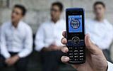 A phone showing the time in September 2013. illustrative image. (photo credit:  Nati Shohat/FLASH90)