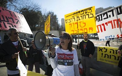 Residents of Tel Aviv's Givat Amal neighborhood protest against the court's decision to evacuate them from their homes outside the Prime Minister's Office in Jerusalem, on Sunday, February 9, 2014. Photo by Yonatan Sindel/Flash90