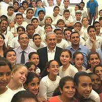 Prime Minister Benjamin Netanyahu and Education Minister Shai Piron meet with schoolchildren in southern Israel on September 1, 2014 (photo credit: Courtesy) Prime Minister Benjamin Netanyahu and Education Minister Shai Piron meet with schoolchildren in southern Israel on September 1, 2014 (photo credit: Courtesy)