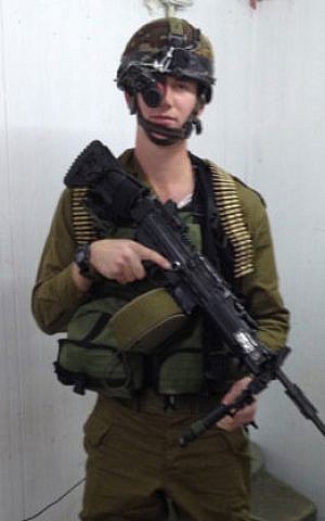 Ethan Gipsman during training in bullet proof vest and Negev light machine gun. (courtesy)