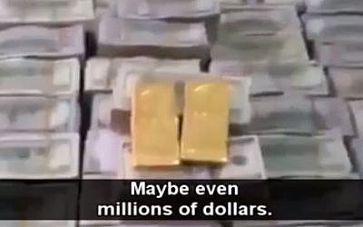 Dollars and gold allegedly captured by Islamic State from the house of Iraqi politician Osama al-Nujayfi. (photo credit: screen capture)