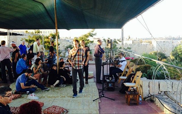 Many coexistence and interfaith events take place in Jerusalem; in September, a small crowd gathered to hear the call of the muezzin through the songs and explanations of a rabbi and sheikh at the Sacred Music Festival (photo credit: Jessica Steinberg/Times of Israel) Many coexistence and interfaith events take place in Jerusalem; in September, a small crowd gathered to hear the call of the muezzin through the songs and explanations of a rabbi and sheikh at the Sacred Music Festival (photo credit: Jessica Steinberg/Times of Israel)