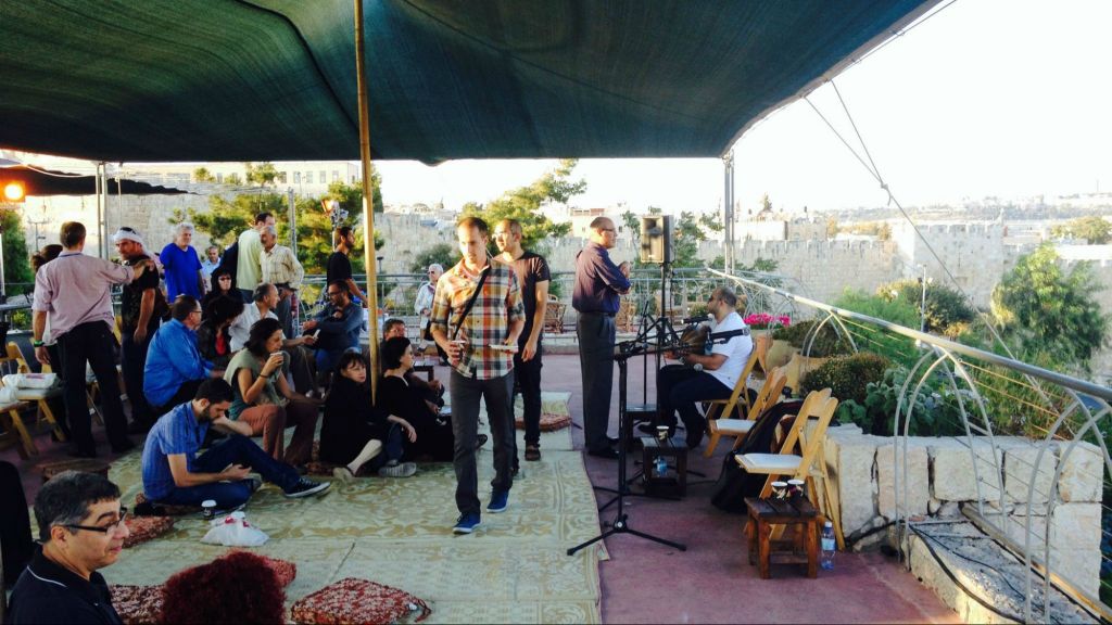 Many coexistence and interfaith events take place in Jerusalem; in September, a small crowd gathered to hear the call of the muezzin through the songs and explanations of a rabbi and sheikh at the Sacred Music Festival (photo credit: Jessica Steinberg/Times of Israel) Many coexistence and interfaith events take place in Jerusalem; in September, a small crowd gathered to hear the call of the muezzin through the songs and explanations of a rabbi and sheikh at the Sacred Music Festival (photo credit: Jessica Steinberg/Times of Israel)