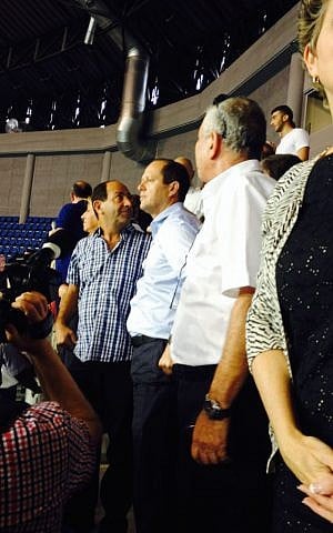 Supermarket scion Rami Levy, who is part of the mayor's Jerusalem Will Succeed faction, stands next to Mayor Nir Barkat in the new stadium (photo credit: Jessica Steinberg/Times of Israel)