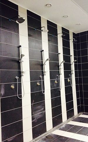 Three-meter-high shower stall for tall basketball players (photo credit: Jessica Steinberg/Times of Israel)