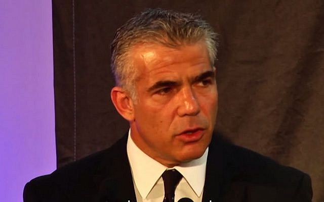 Finance Minister Yair Lapid address a counter-terrorism conference in Herzliya (screen capture: YouTube)