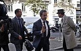 Former French President Nicolas Sarkozy arrives at a hotel in Paris, Friday, September 19, 2014. (AP Photo/Thibault Camus)